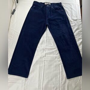 Men’s Patagonia corduroy pants in a dark blue color.